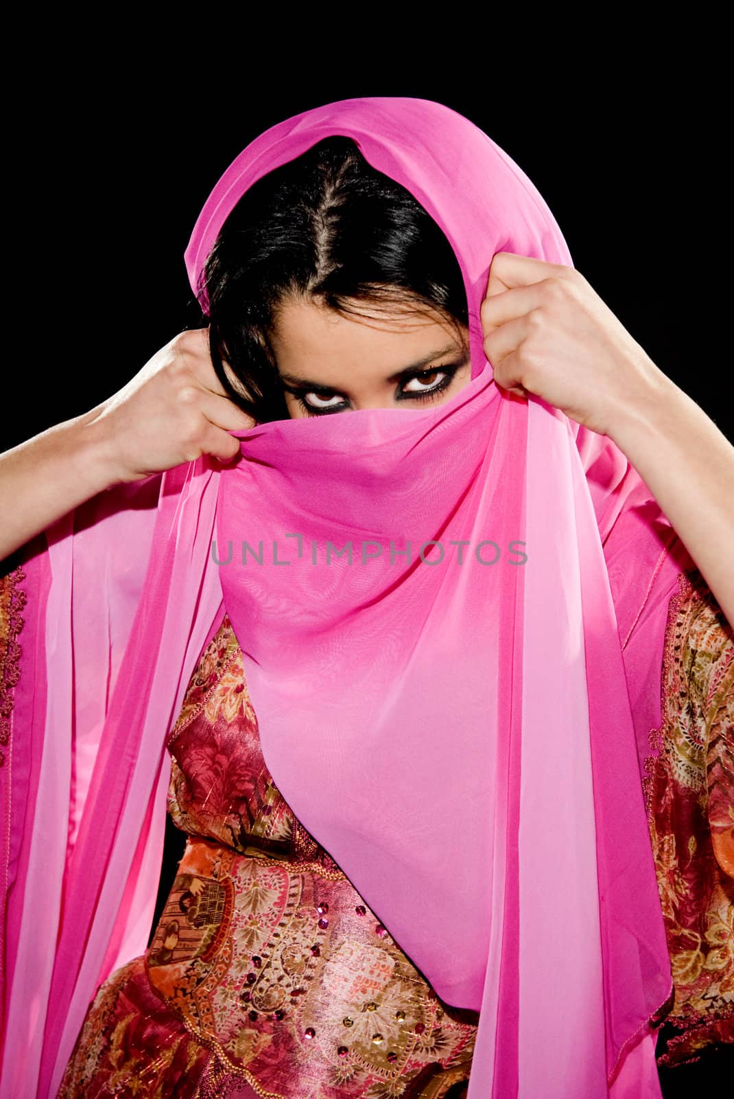 Arabian woman wearing traditional dress on black background