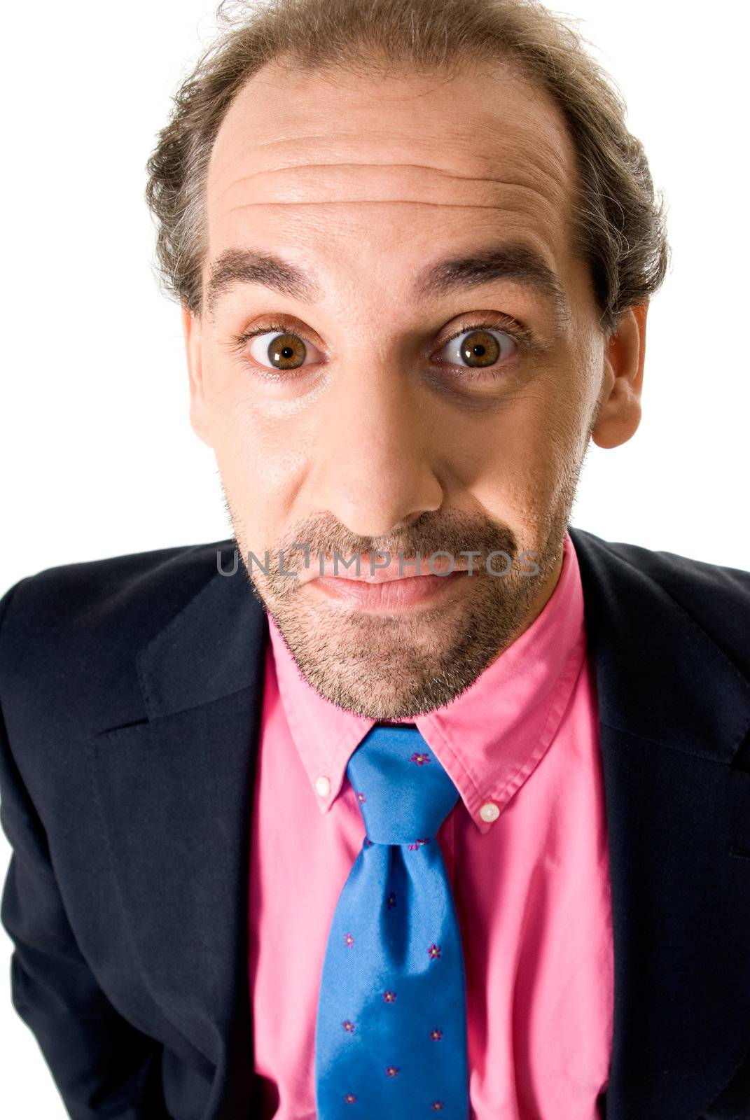 Cheerful businessman with surprise expression on white background.