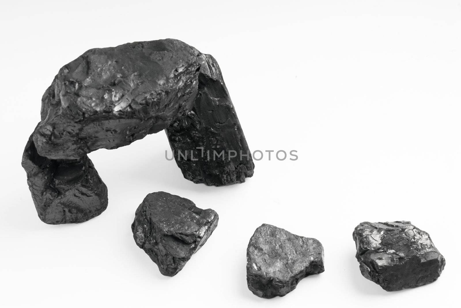 Carbon nuggets on a white background 