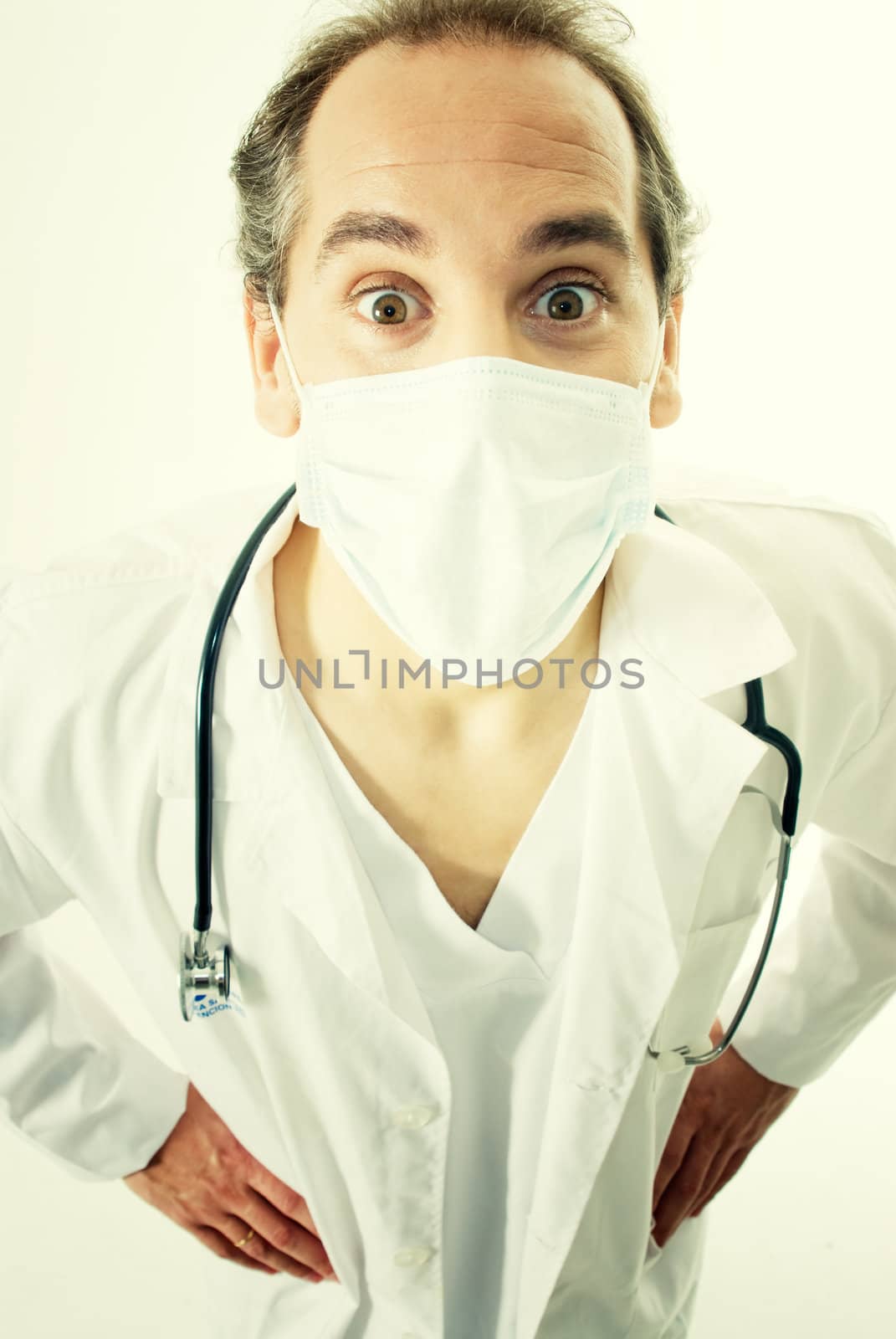 Doctor with stethoscope and flu mask.