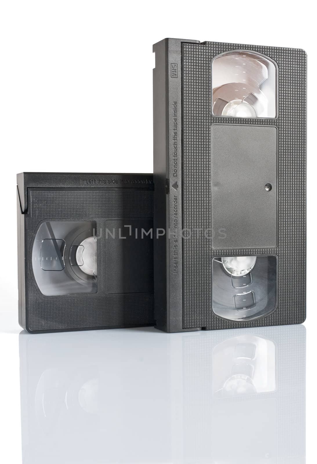 two vhs video cassettes isolated on white background with clipping path