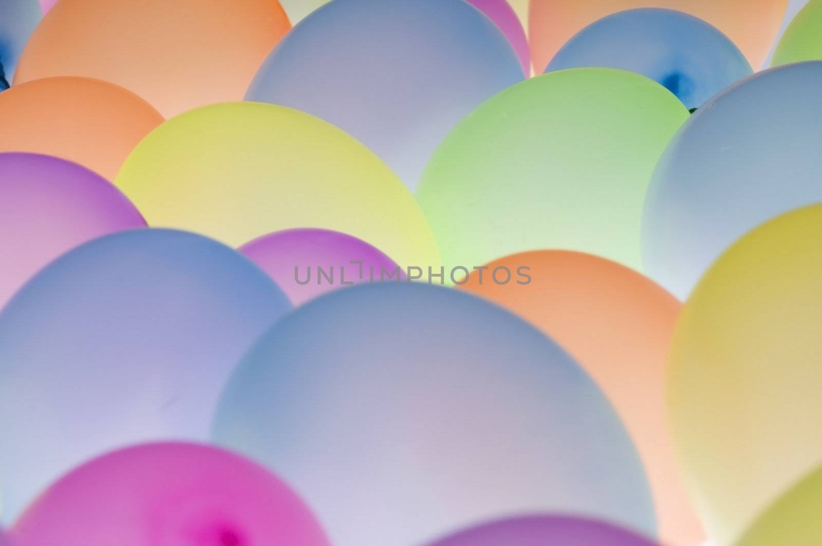 abstract texture background of backlite colorful ballons in different sizes