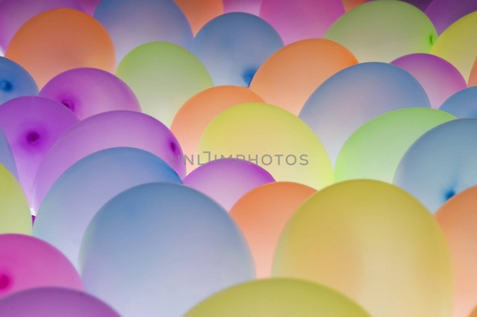 abstract texture background of backlite colorful ballons in different sizes
