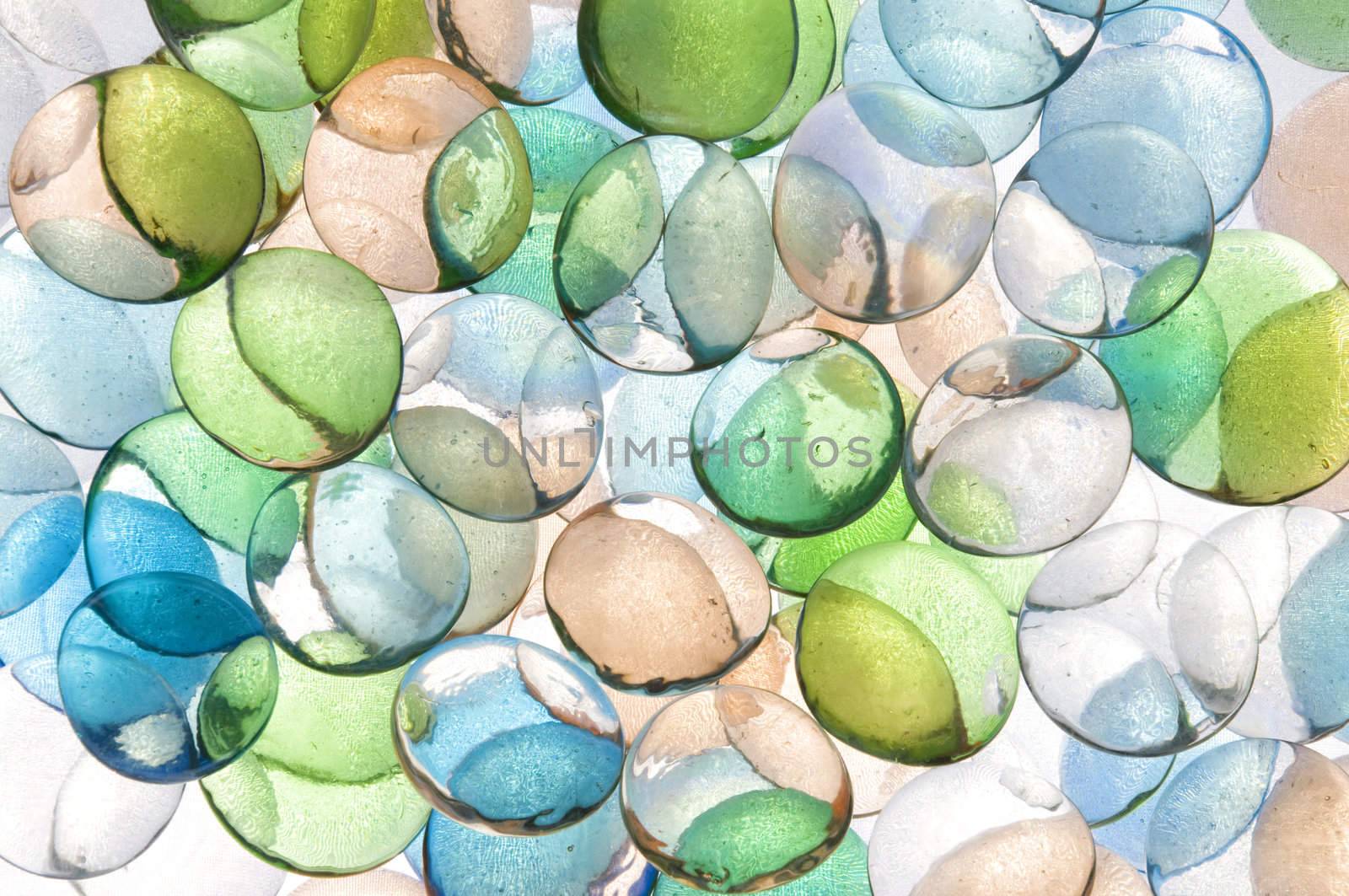 colorful background texture of backlite glass stones of different sizes