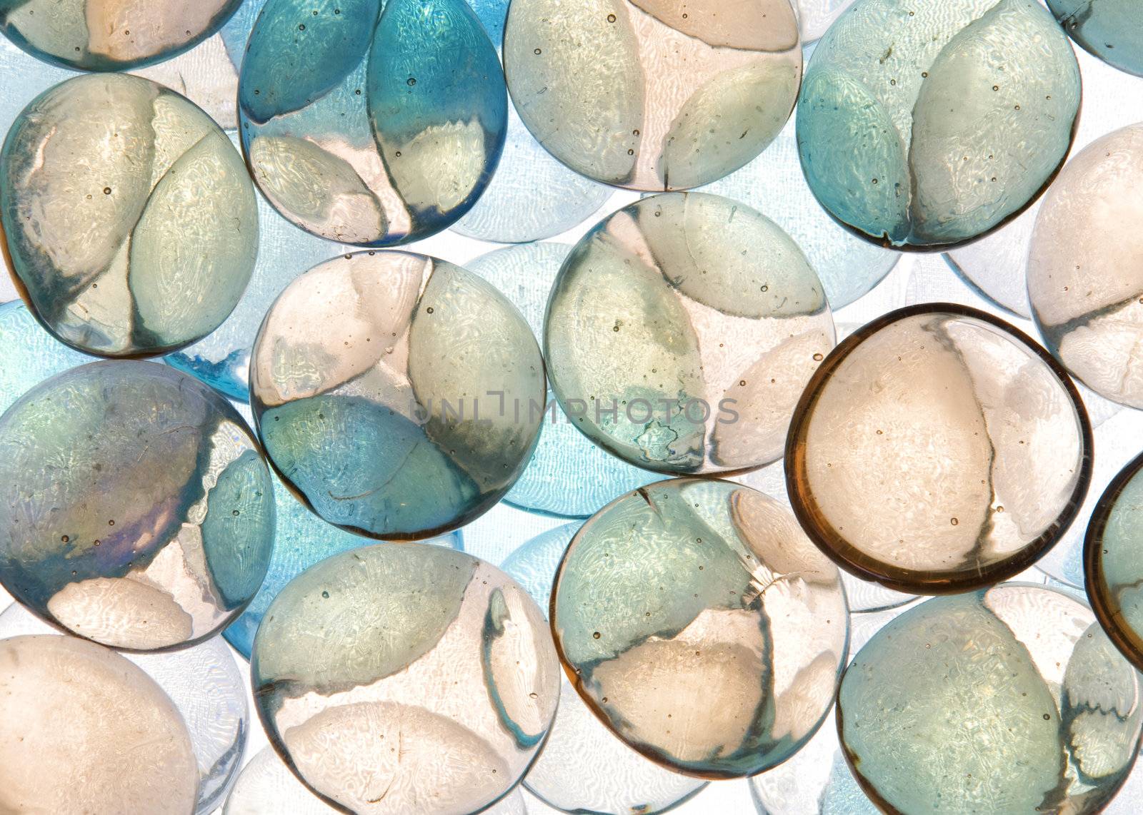 colorful background texture of backlite glass stones of different sizes