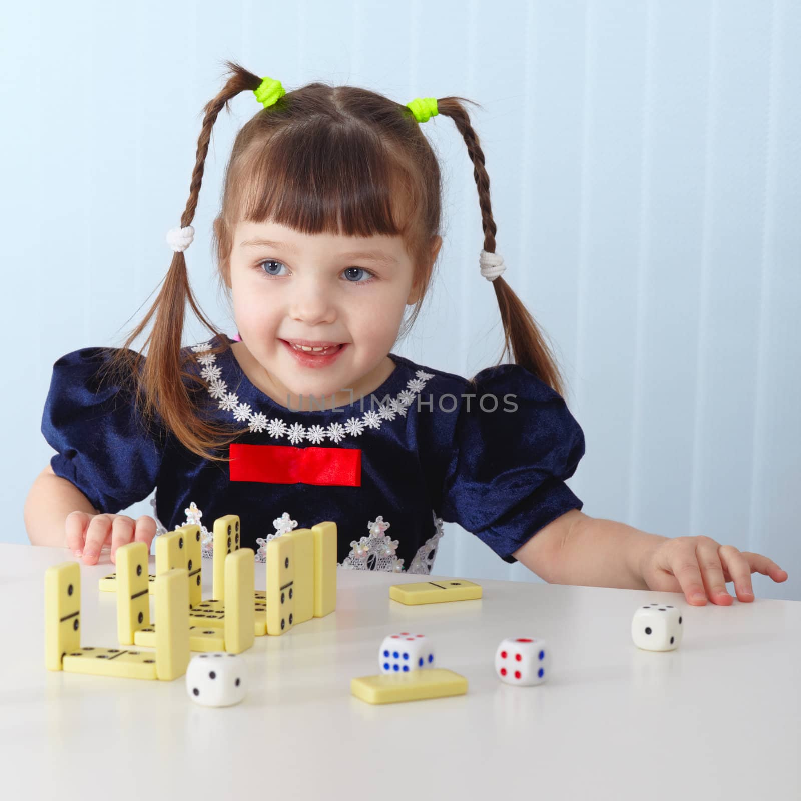 Smiling girl sitting at table by pzaxe