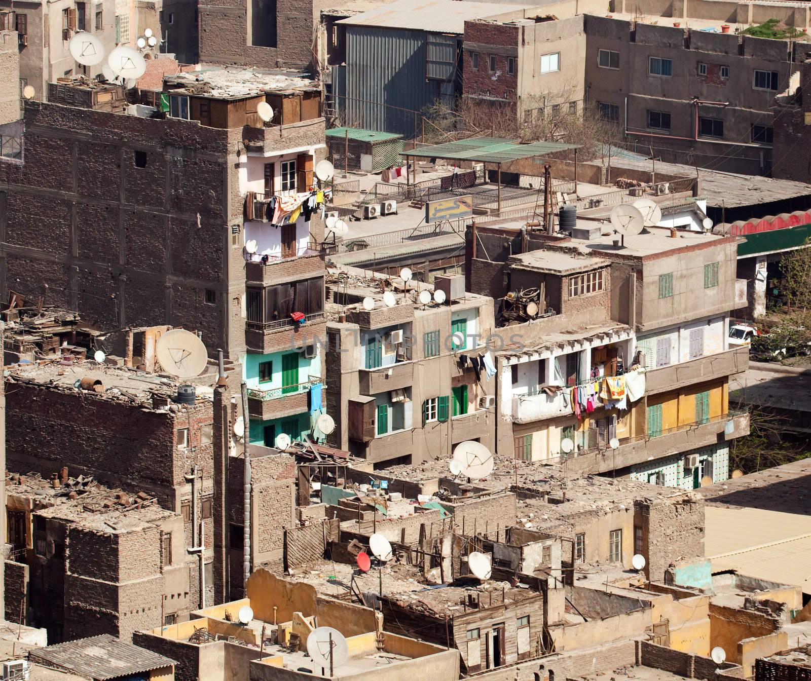 Unfinished buildings in downtown Cairo with trash on all roofs
