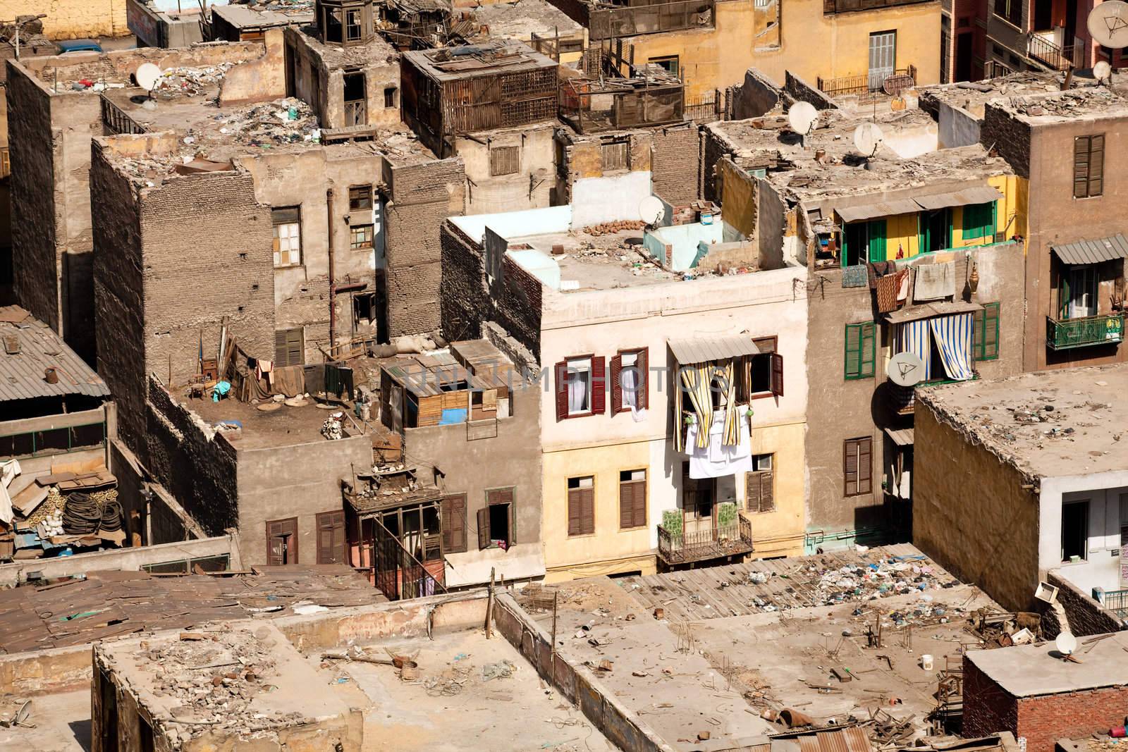 Unfinished buildings in downtown Cairo with trash on all roofs