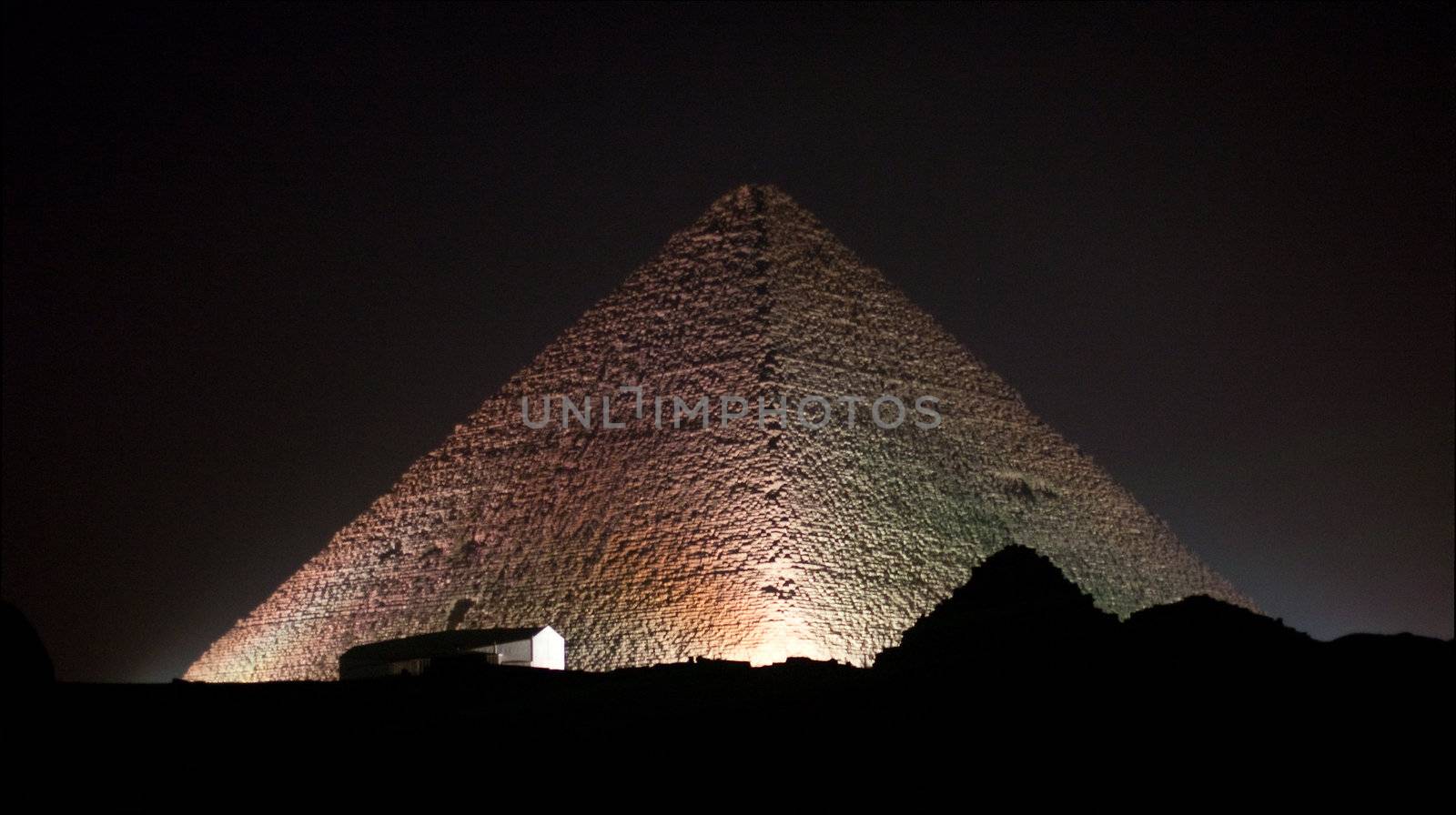 Colored lights illuminate Sphinx and Pyramids by steheap