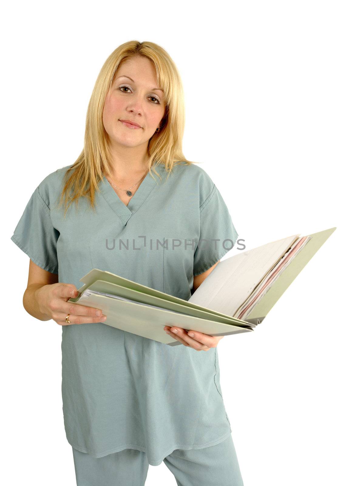 A beautiful young blond female doctor, dentist, nurse looking through medical files.
