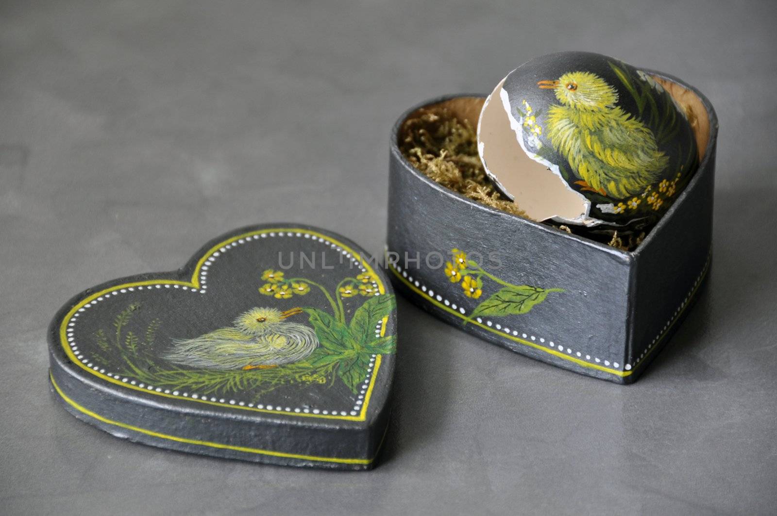 Hand painted easter egg in crafted heart shaped box