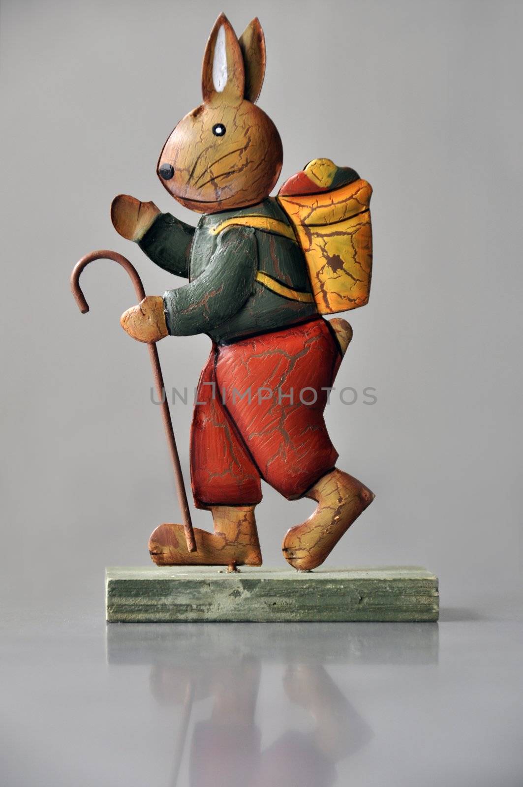 Retro easter decoration - marching bunny on light grew with reflection