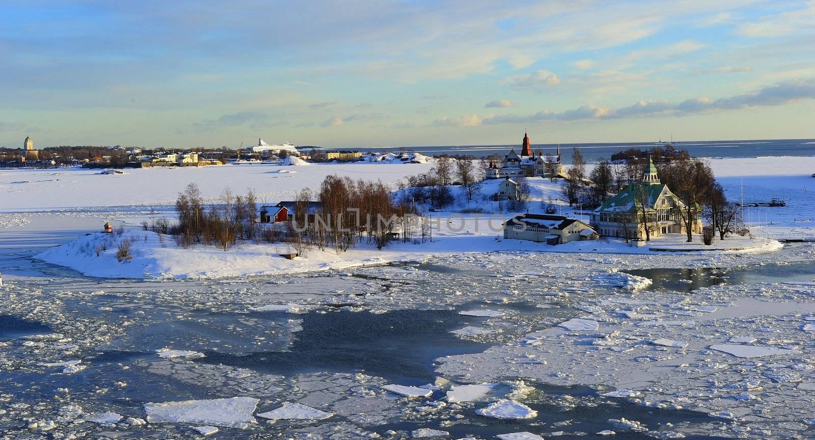 Icy Baltic sea around Helsinki, with Finnish houses on islands