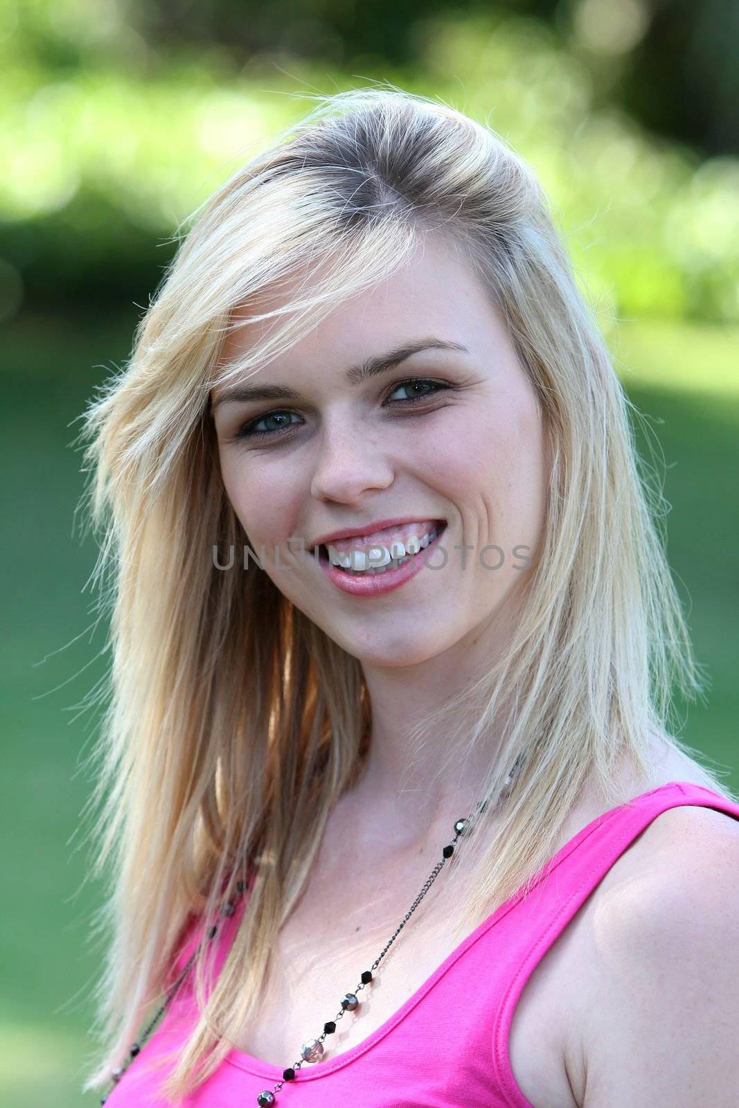 Portrait of a lovely blond lady with a big smile