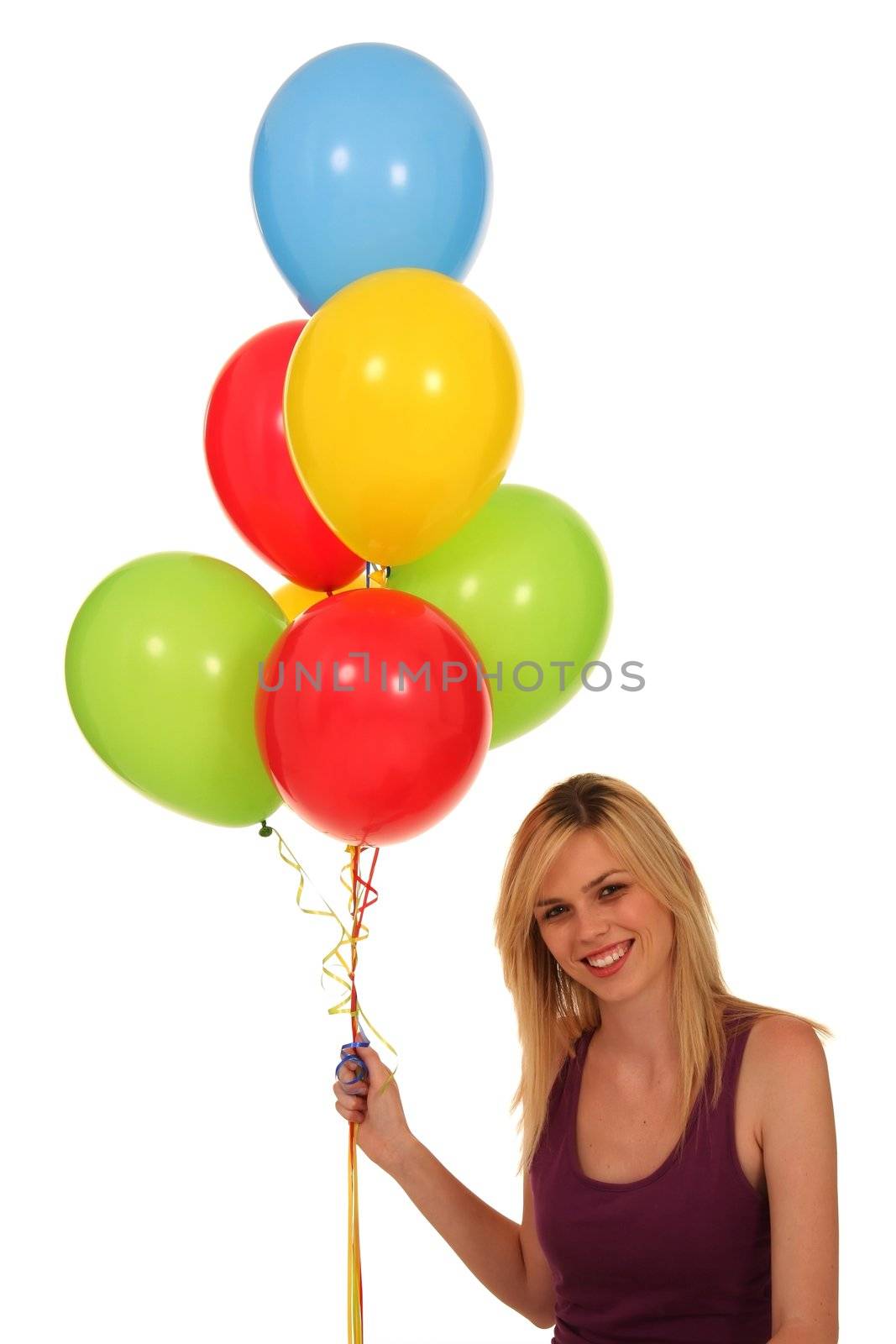 Gorgeous blond girl holding a colorful bunch of balloons