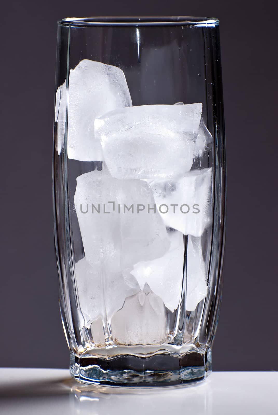 A tall glass filled with ice
