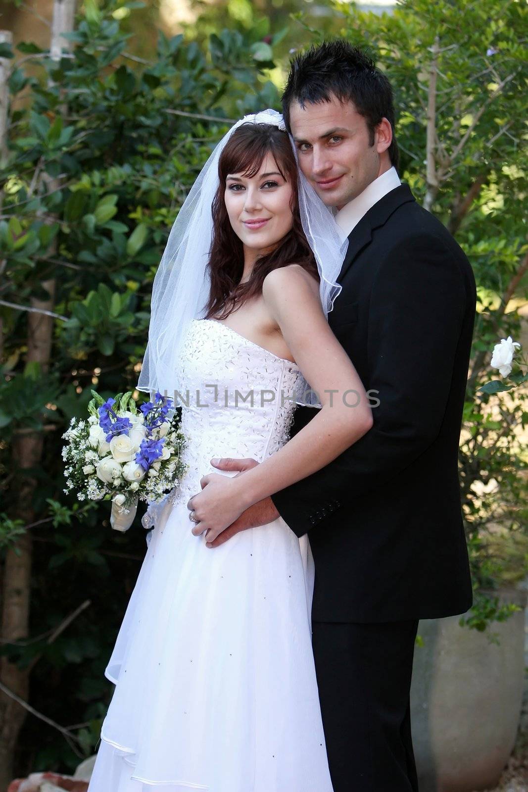 Beautiful happy smiling couple on their wedding day