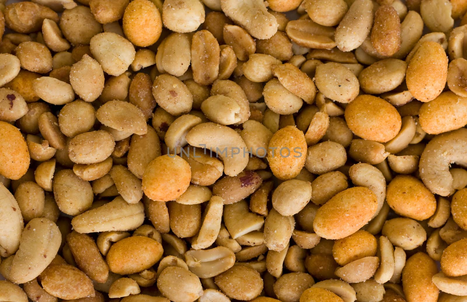 Mixed nuts, nice background. Salted and honey roasted peanuts, chili nuts and cashews, 