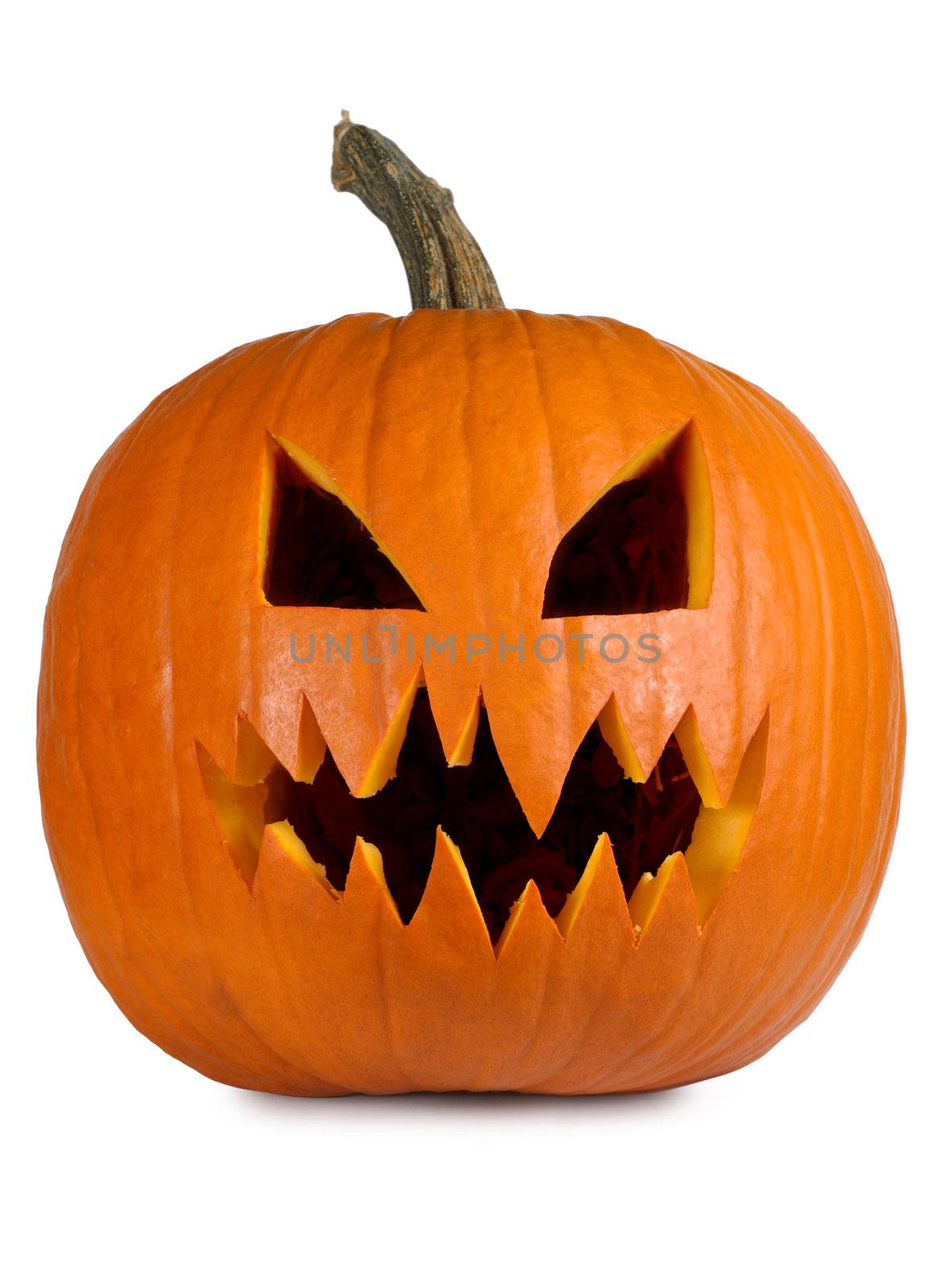 Photograph of a isolated carved evil pumpkin. Clipping path included.