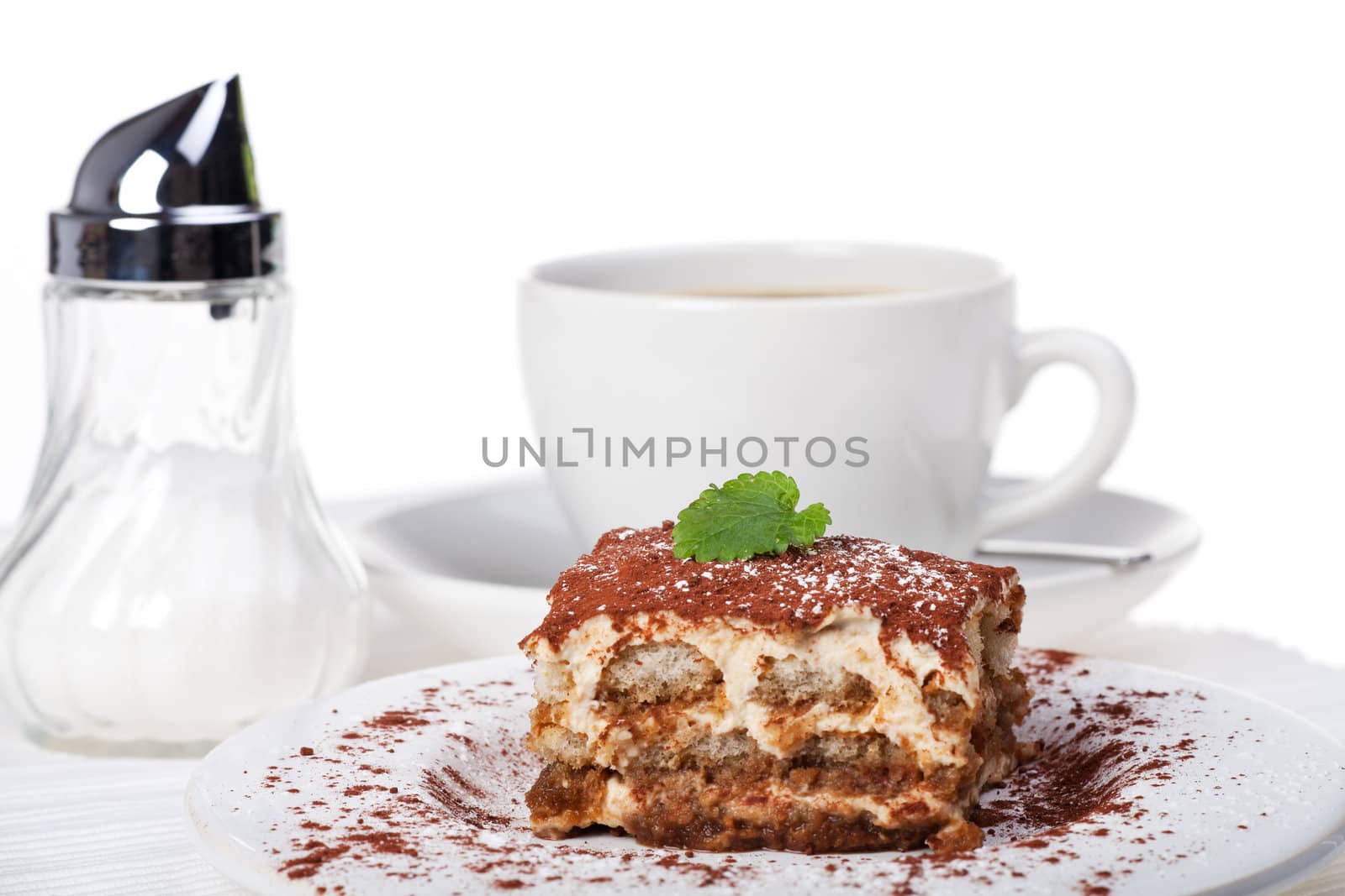 tiramisu cake with a cup of coffee