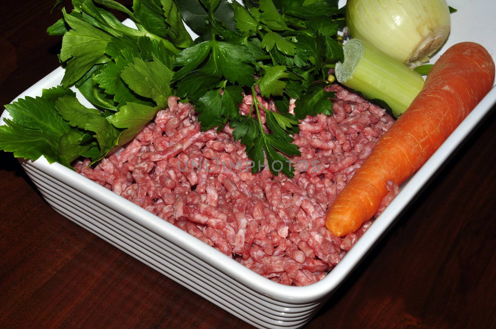 raw minced beef with carrots, parsley and onion