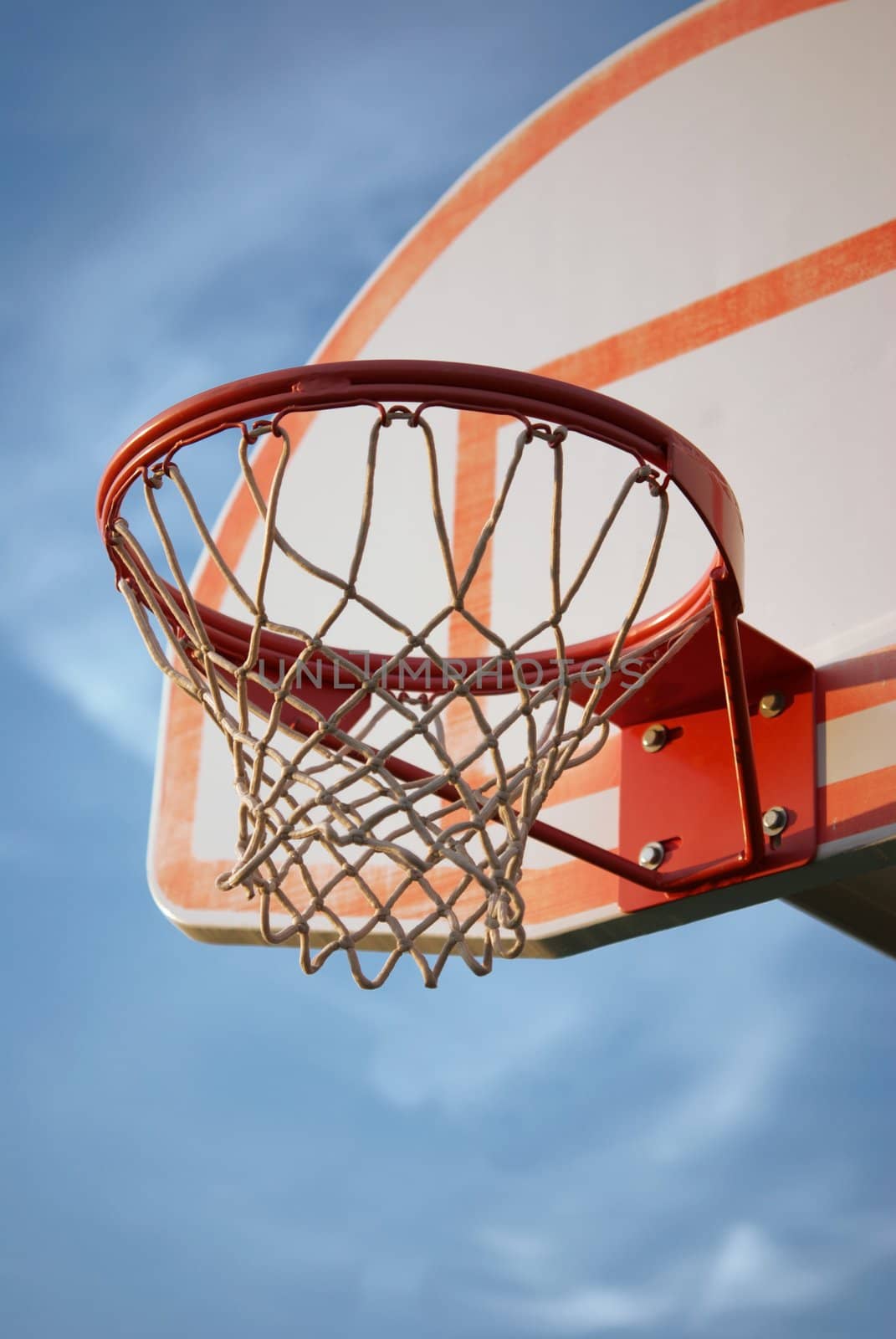 Close up of a faded basketball hoop and standard