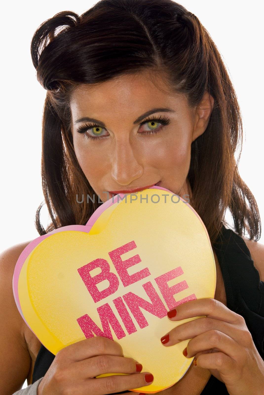 Sexy Woman Biting a Sign that Reads "Be Mine"