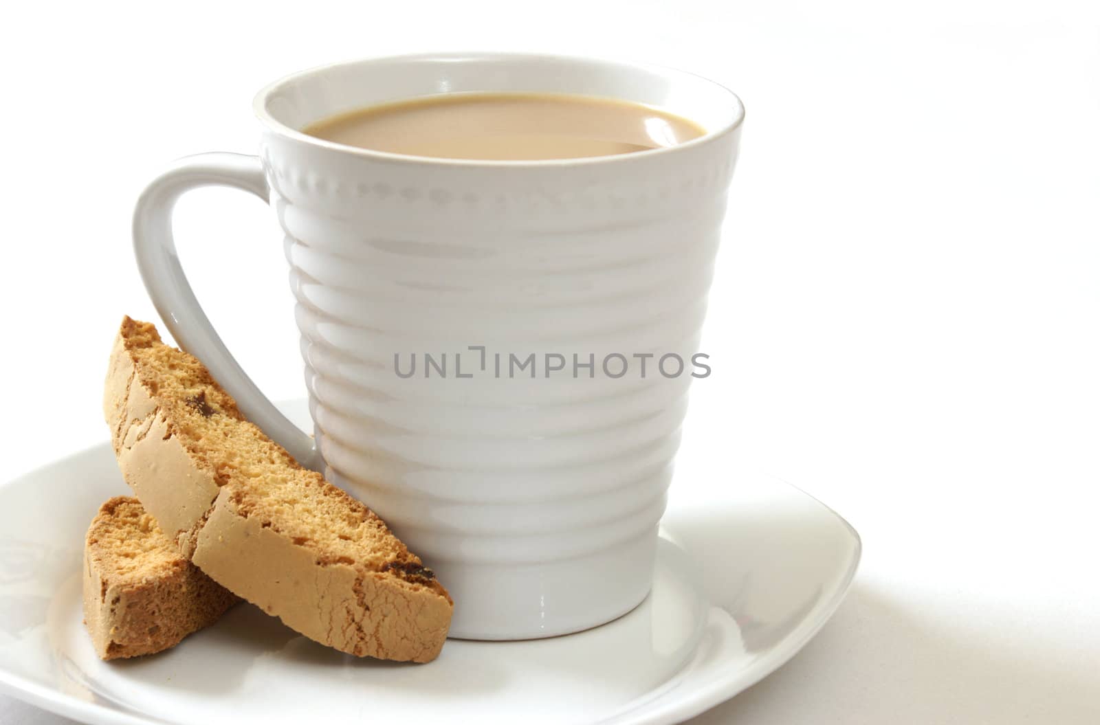 A cup of coffee with some strawberry biscotti.