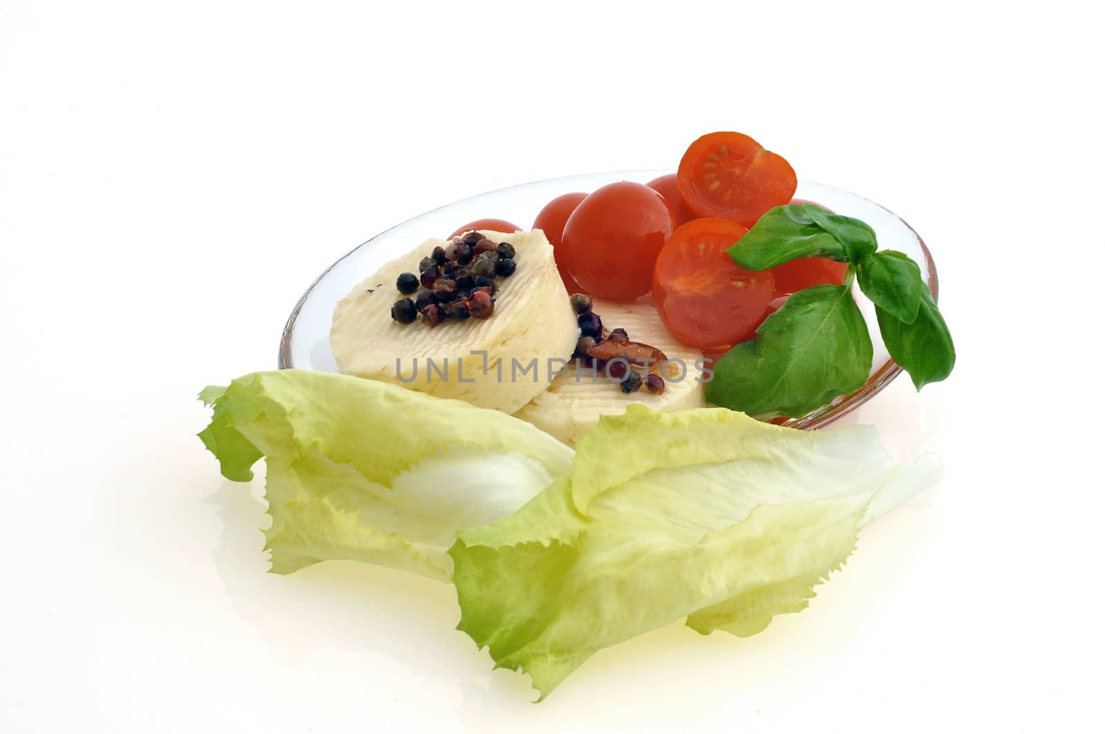 tomatoes, cheese and salad on white background