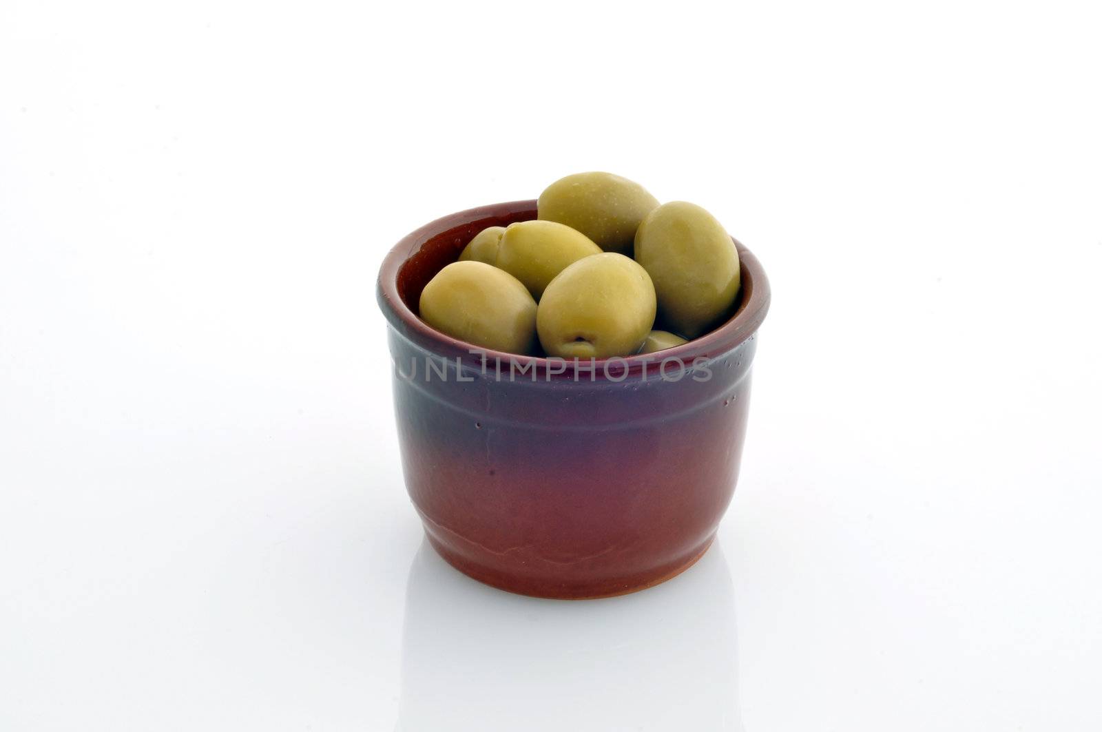 a container with olives on a white background