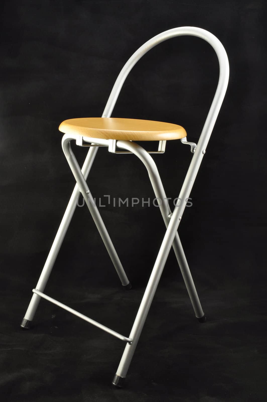 wooden folding stool chiaroe steel on a black background