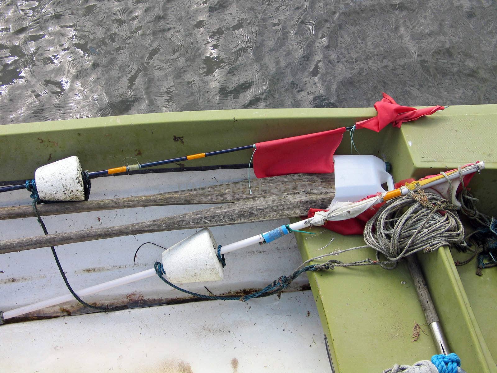 Fishing gear on a small boat in a marina