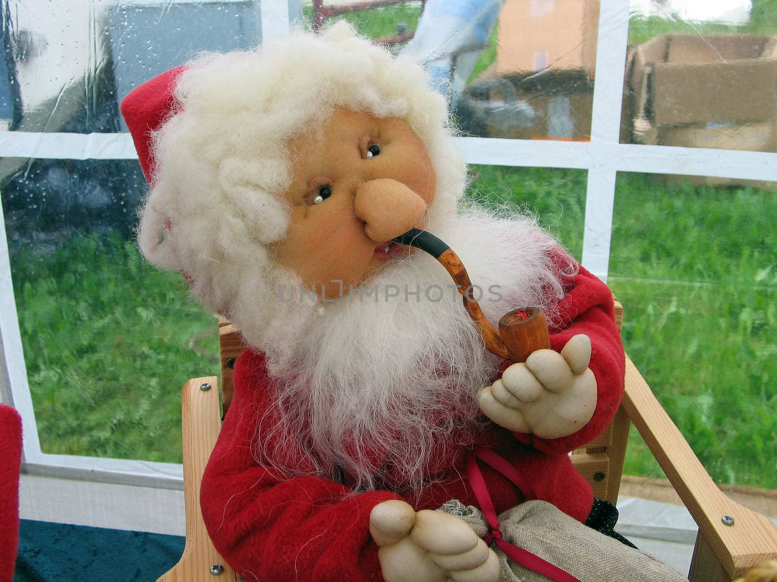 Christmas doll figurine of cute smiling grandfather