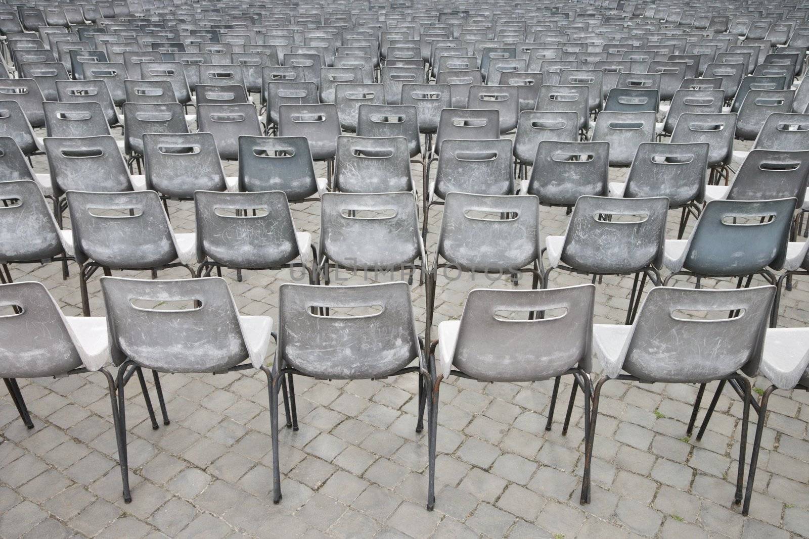 Close-up shot of several chairs in Saint Peter's Square in Vatican City, Italy.