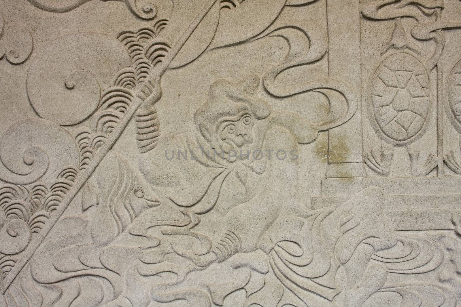 The marble stone people of chinese myth relief sculpture in an ancient Chinese temple.
