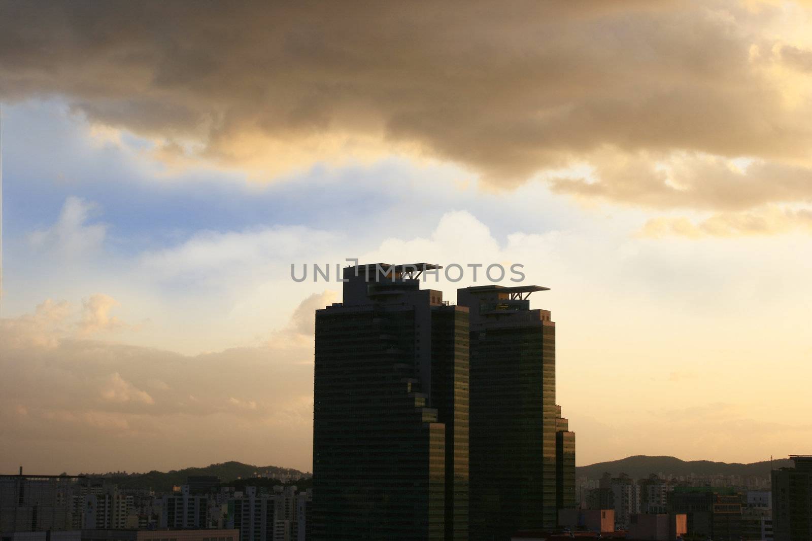 newly constructed modern office building with sunset in background