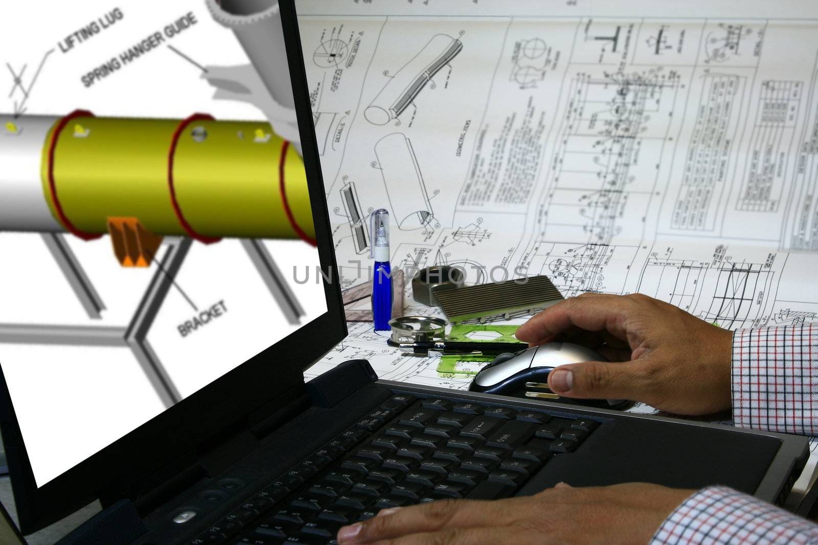 An engineer draw his design into the computer using CAD design