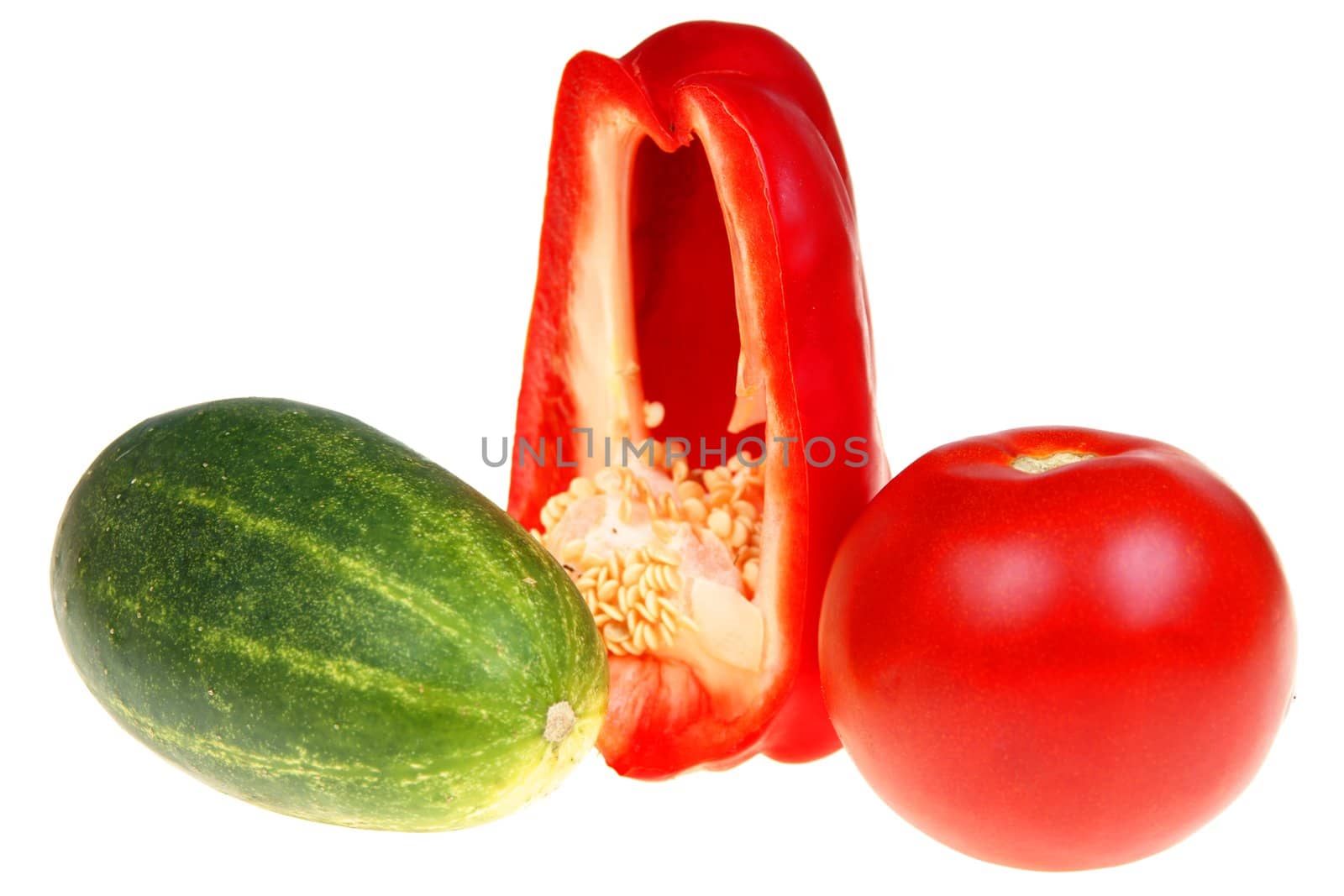 Green cucumber paprika and tomato isolated on white background