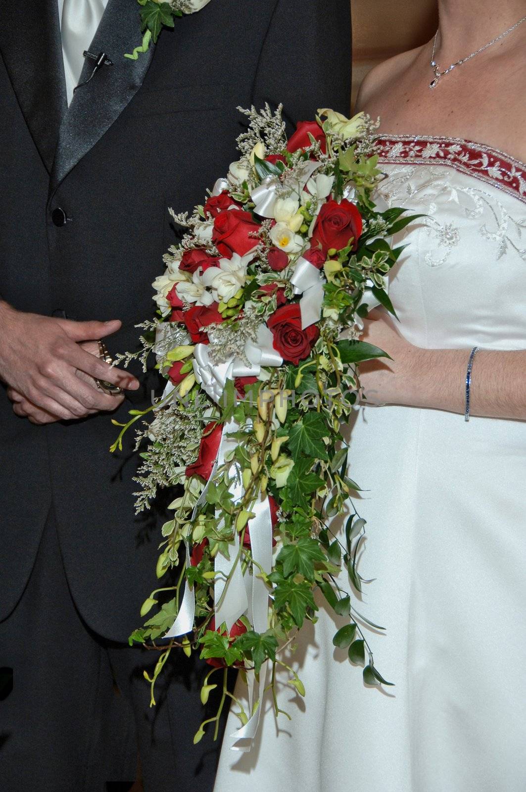 A bride and groom with the brides flowers