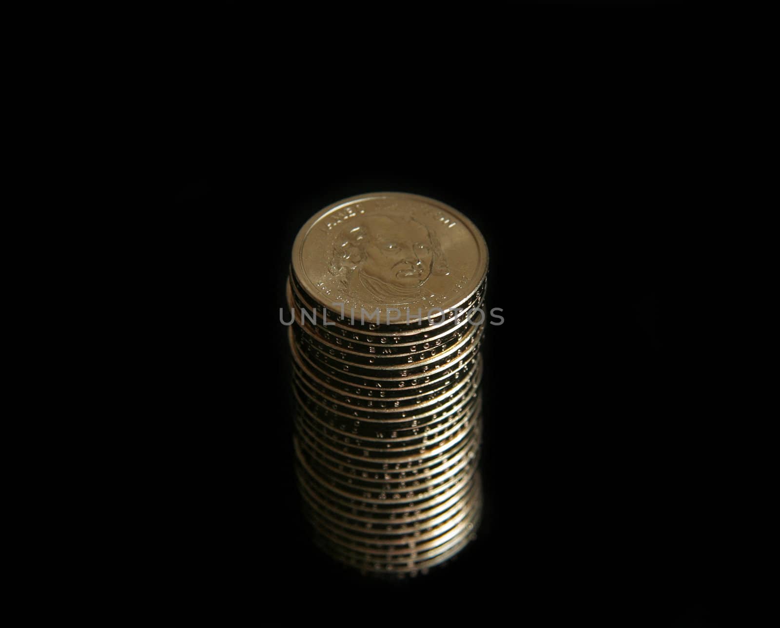 A single stack of gold U.S. one dollar coins