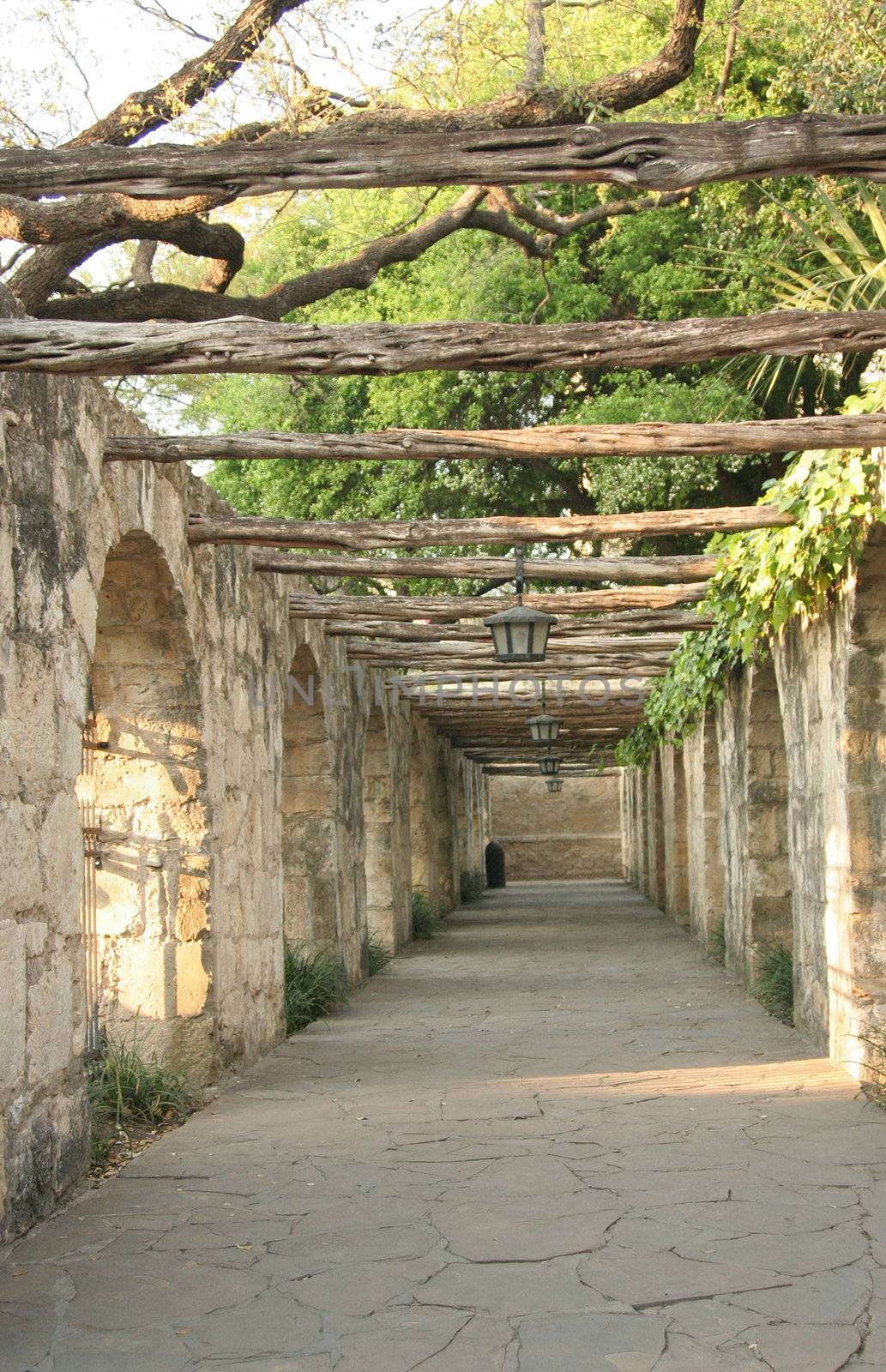 A timber lined colonnade at the Alamo in San Antonio Texas