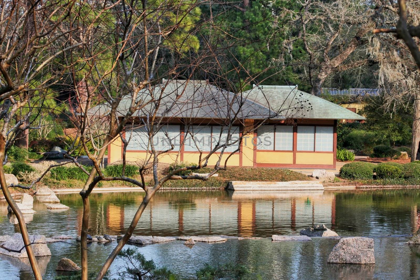 A Japanese Tea House setting at the edge of a refection pond
