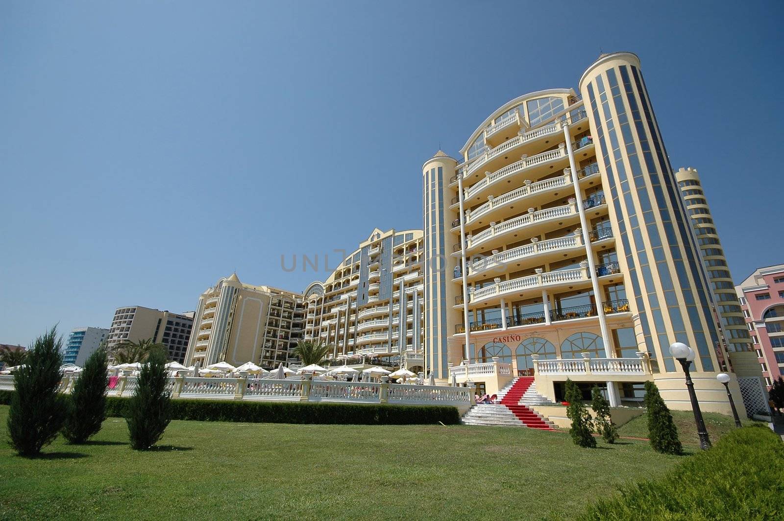 Hotel and blue sky. The hotel is very big and tall.