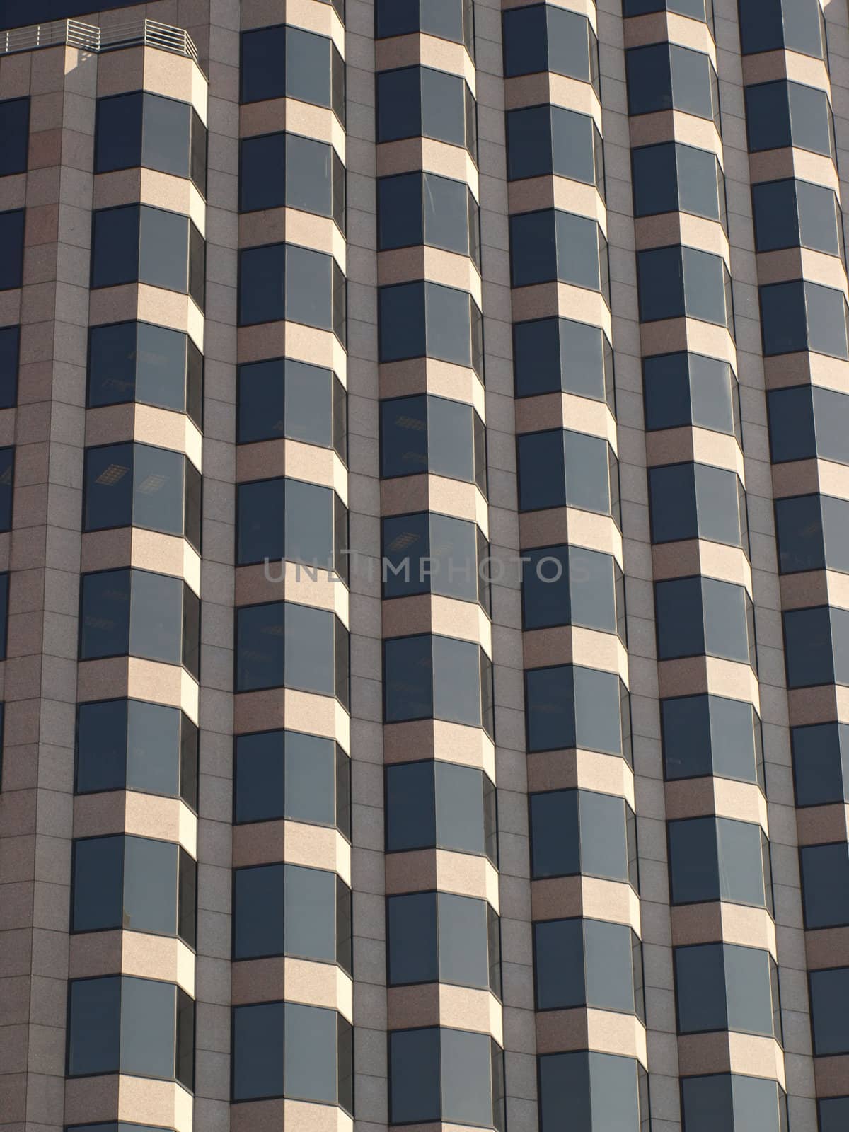 A brown glass and brick office building in North Carolina