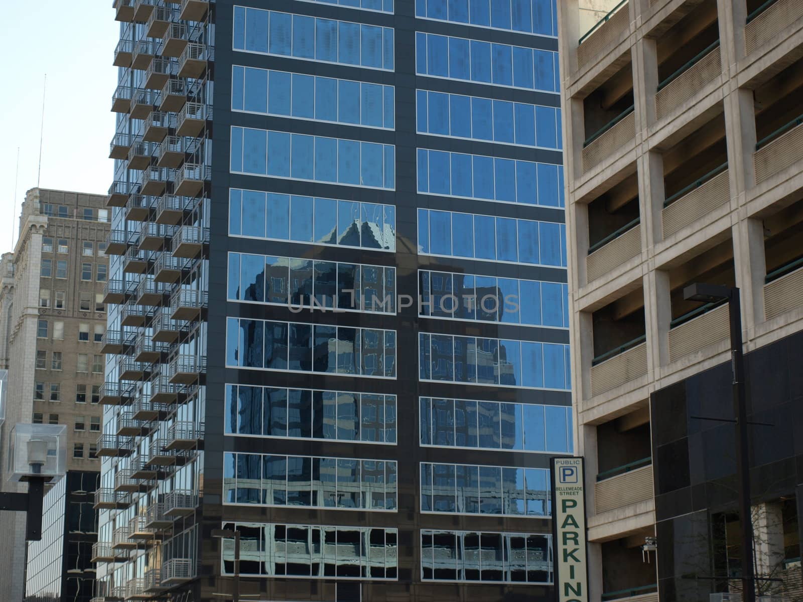 A glass building in downtown Greensboro,North Carolina. Notice the reflection on the glass.