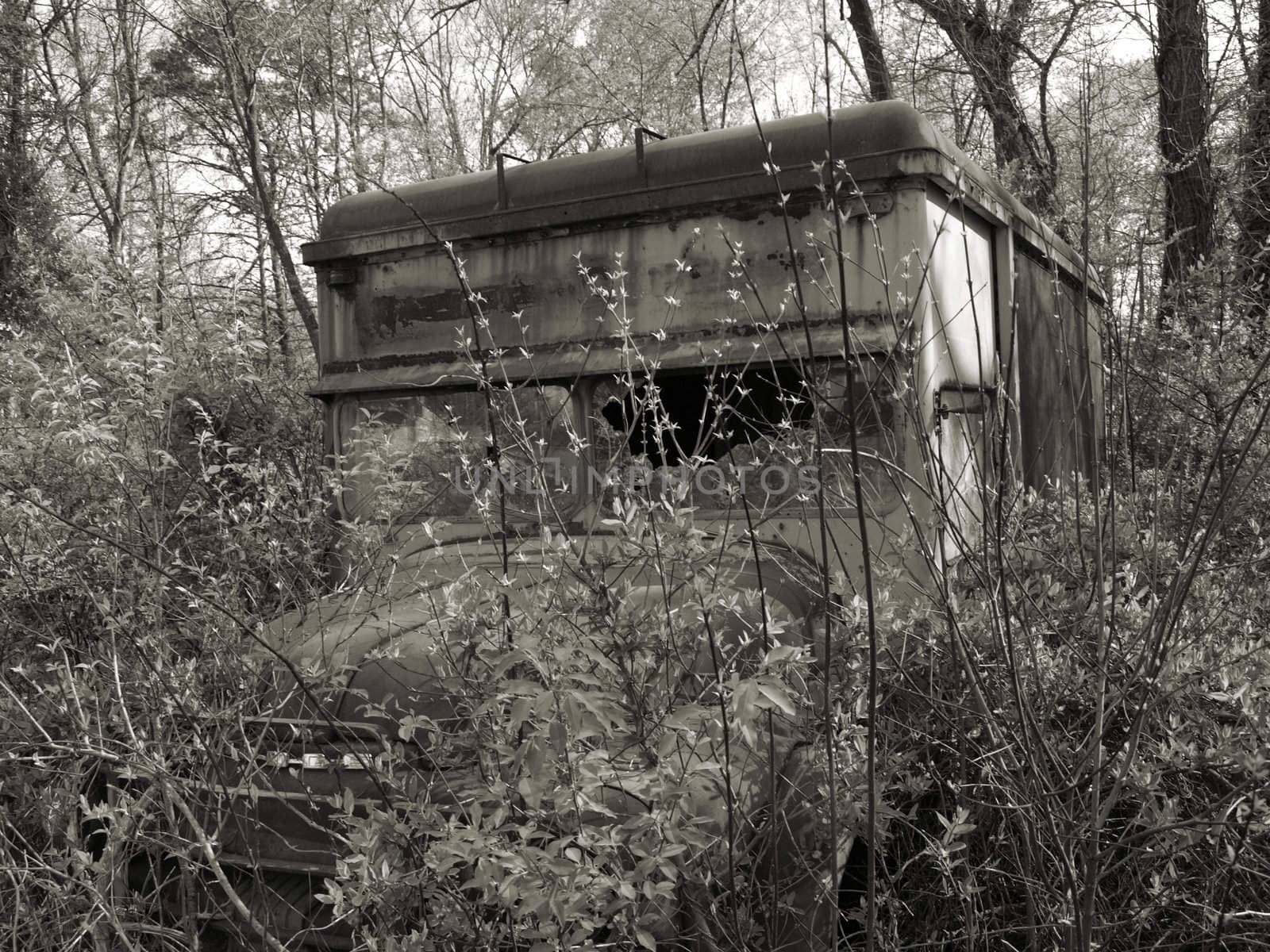 An old abandonded truck shown in black and white