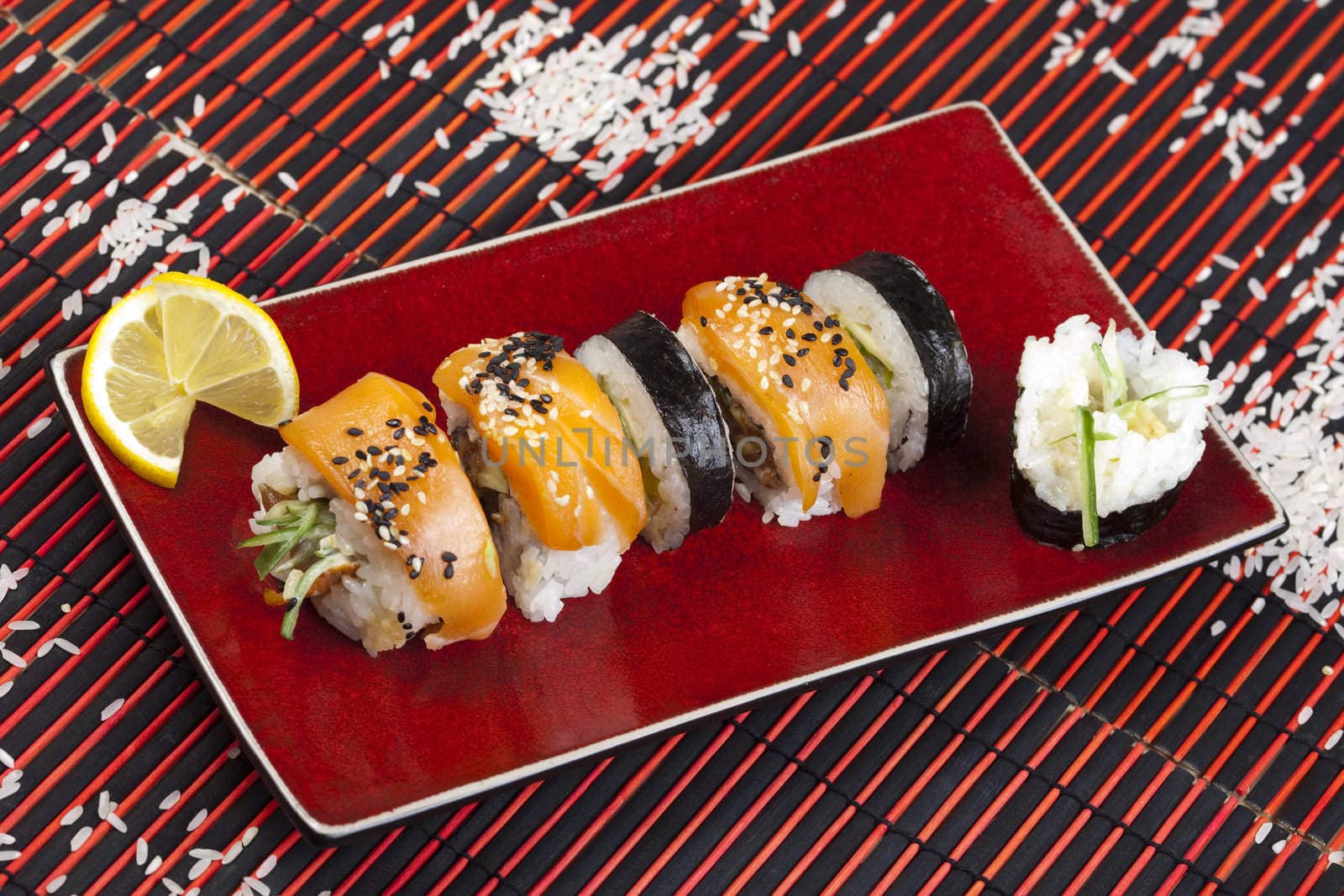 A complete sushi meal with chopsticks on tatami mat