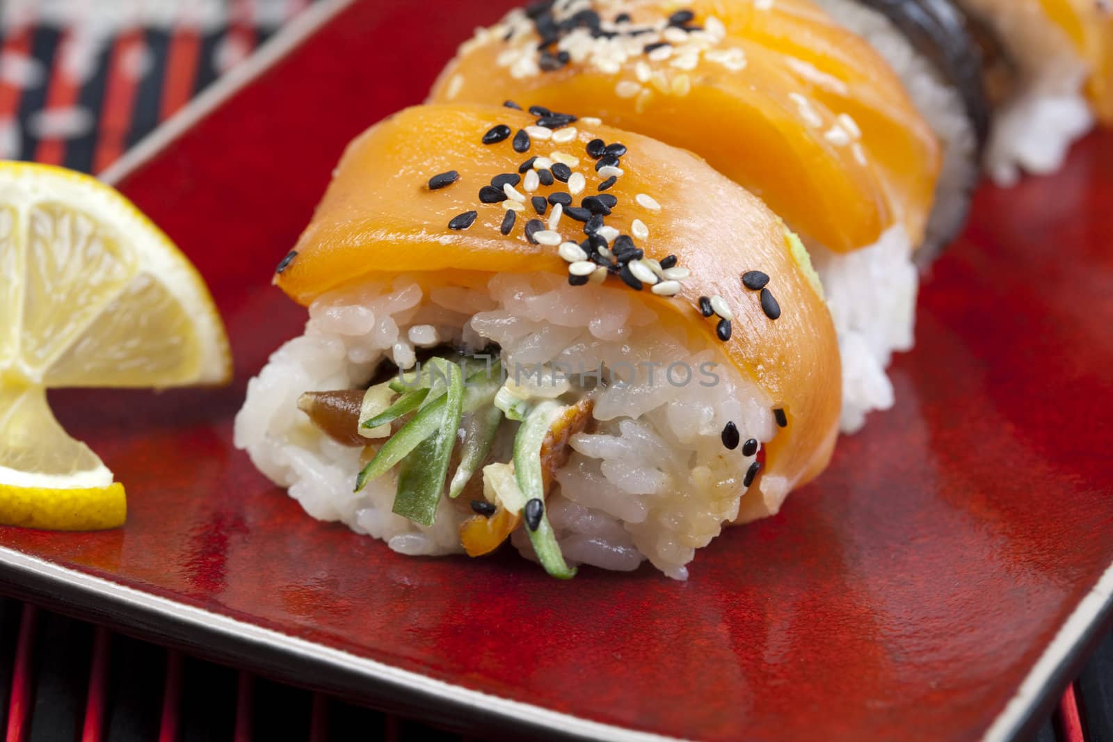 A complete sushi meal with chopsticks on tatami mat