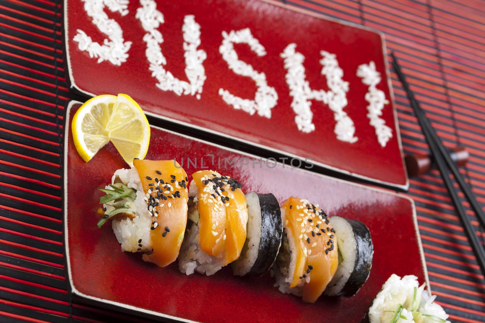 A complete sushi meal with chopsticks on tatami mat