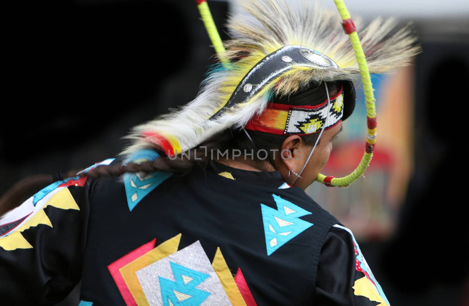 A Native American performs a traditional hoop dance